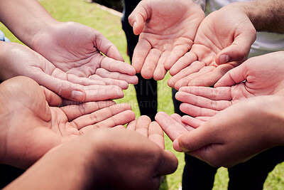 Buy stock photo Cropped shot of a group of unrecognisable people with their hands opened