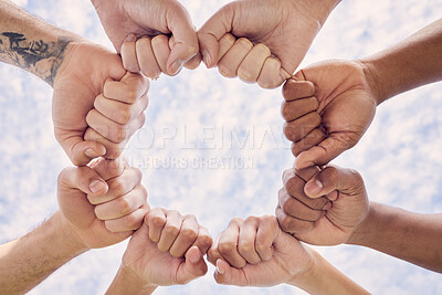 Buy stock photo Cropped shot of a group of unrecognizable people joining their hands in solidarity