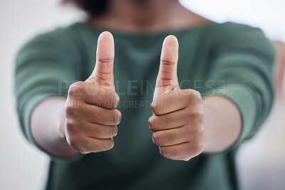 Buy stock photo Shot of an unrecognisable businesswoman showing thumbs in a modern office