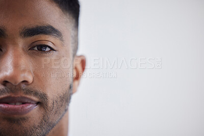 Buy stock photo Portrait of a young businessman standing against a grey background