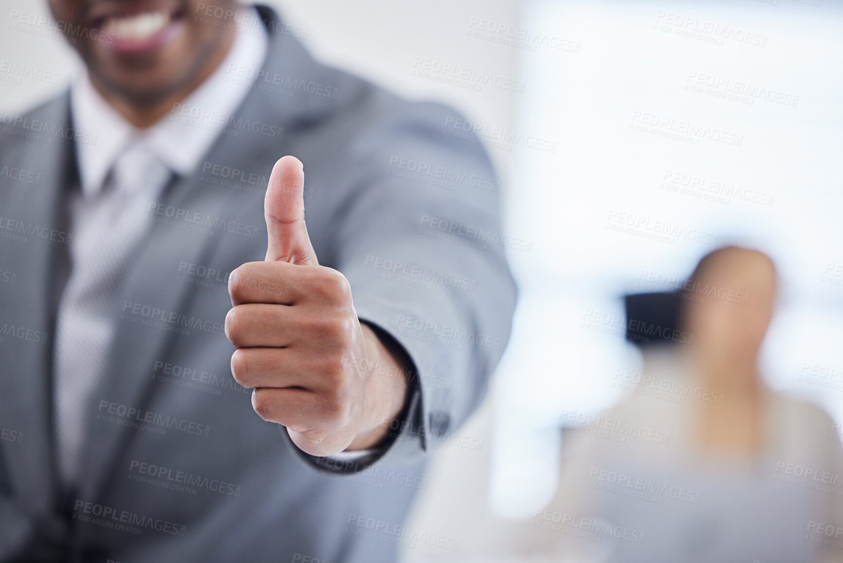Buy stock photo Shot of an unrecognisable businessman showing thumbs in a modern office
