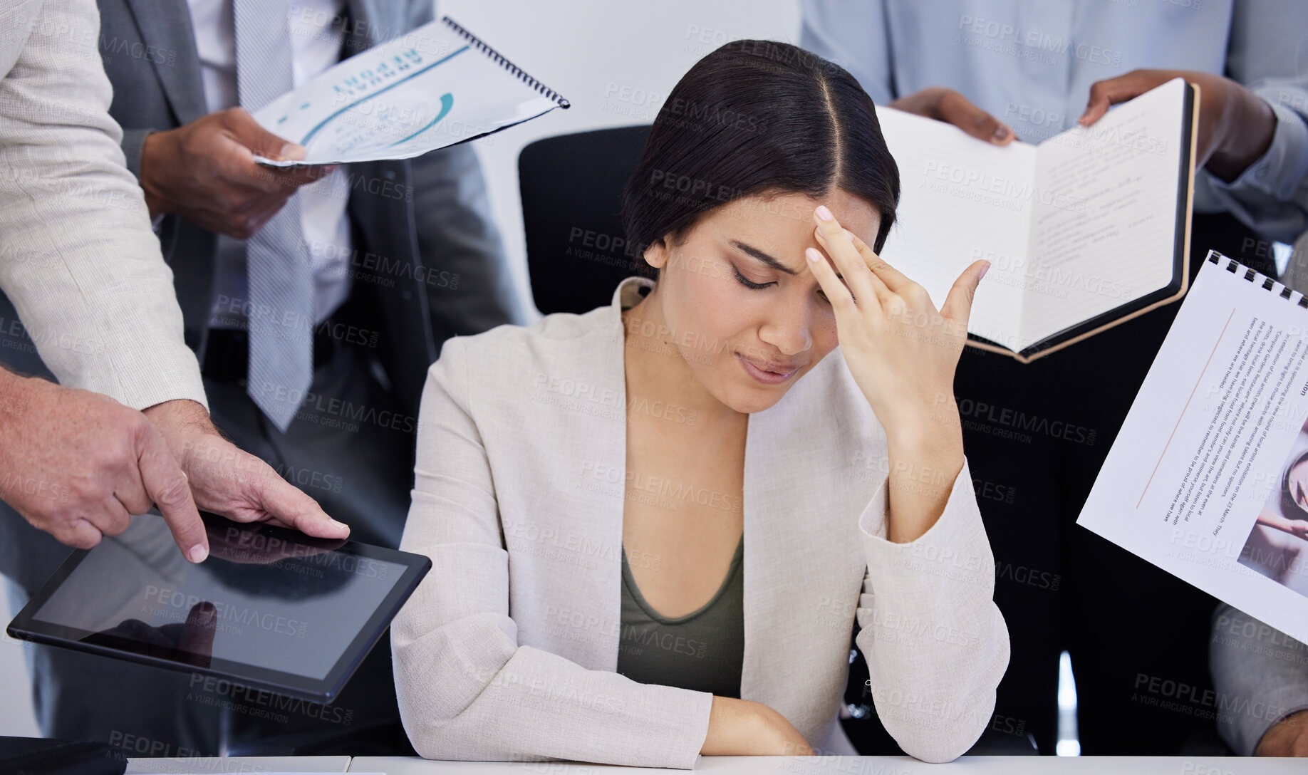 Buy stock photo Shot of a young businesswoman looking stressed out in a demanding office environment