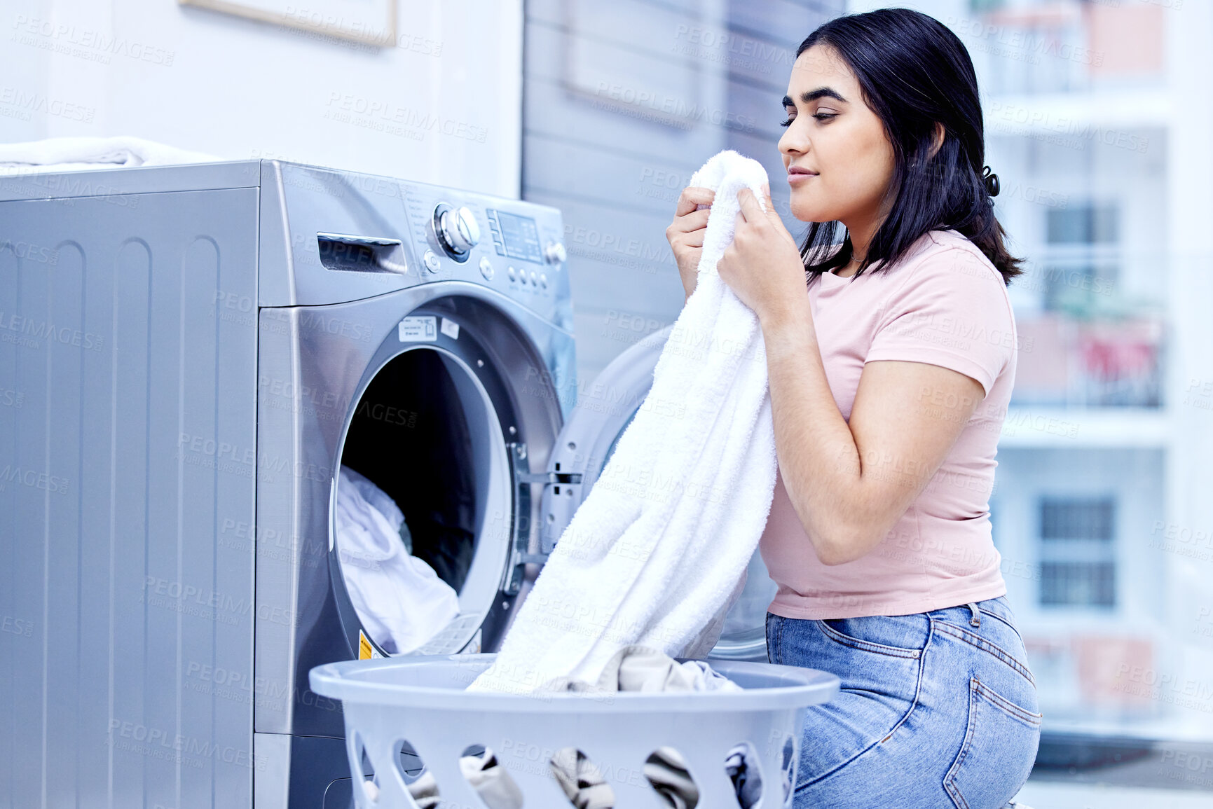 Buy stock photo Laundry machine, smell and woman in home for cleaning, hygiene and housework in the morning. Chores, scent and girl with fresh fabric, cotton clothes and textile towel in washing basket for service