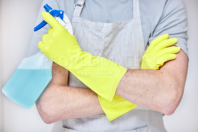 Buy stock photo Hands, man and cleaning with detergent for hygiene in studio with chemicals for safety or protection from germs or disease. Housekeeping, cleaner and arms crossed with gloves for health product