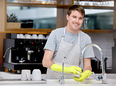 Buy stock photo Cleaning, washing and dishes for man in home kitchen, portrait and gloves for hand. Dirty, smile and hygiene with soap for bacteria prevention, germs and disinfect crockery for ocd male person