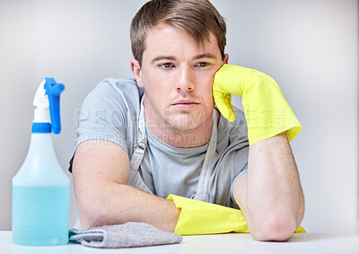 Buy stock photo Gloves, bored and spray bottle for male cleaner, hands and safety for housekeeper. Tired, overworked or annoyed man with disinfectant for hygiene, housework or dirt and spring cleaning or washing