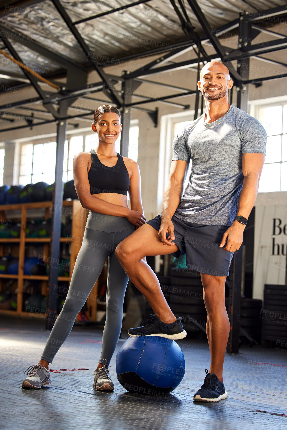 Buy stock photo Fitness, gym and portrait of a man and woman with a medicine ball for training, workout or class. Couple of friends as client person and personal trainer at a health and wellness club for exercise