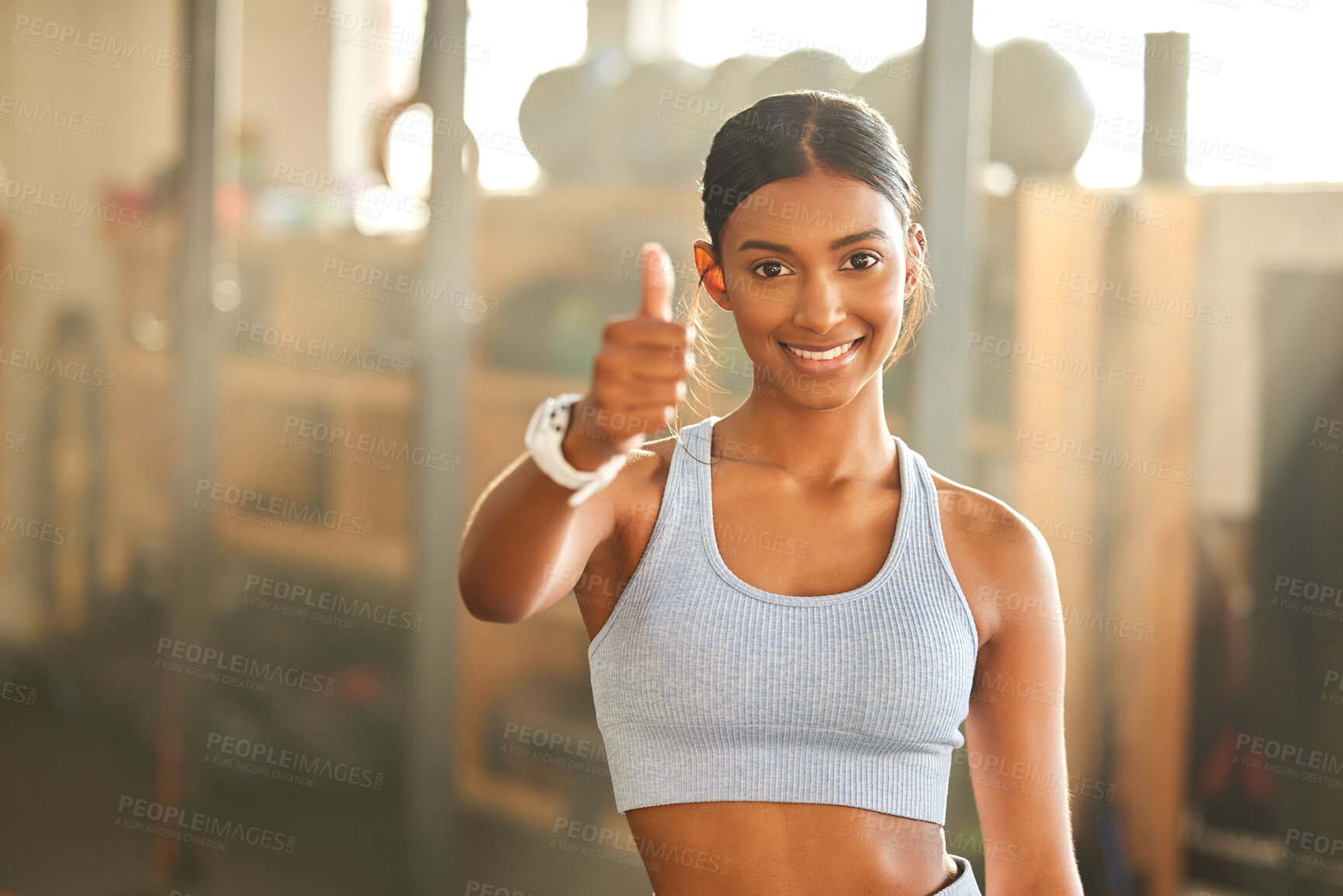 Buy stock photo Gym, portrait or Indian woman with thumbs up in fitness training with positive mindset or motivation. Encouragement, support or happy personal trainer in workout with like hand sign or thumb up 