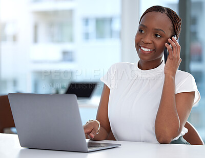 Buy stock photo Shot of a young businesswoman talking on a cellphone while working on a laptop in an office