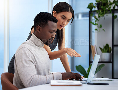 Buy stock photo Team, man and woman in pointing at laptop, notes and review for performance in company. Diverse, businesspeople and coworkers in workplace, corporate and startup in collaboration for digital or tech