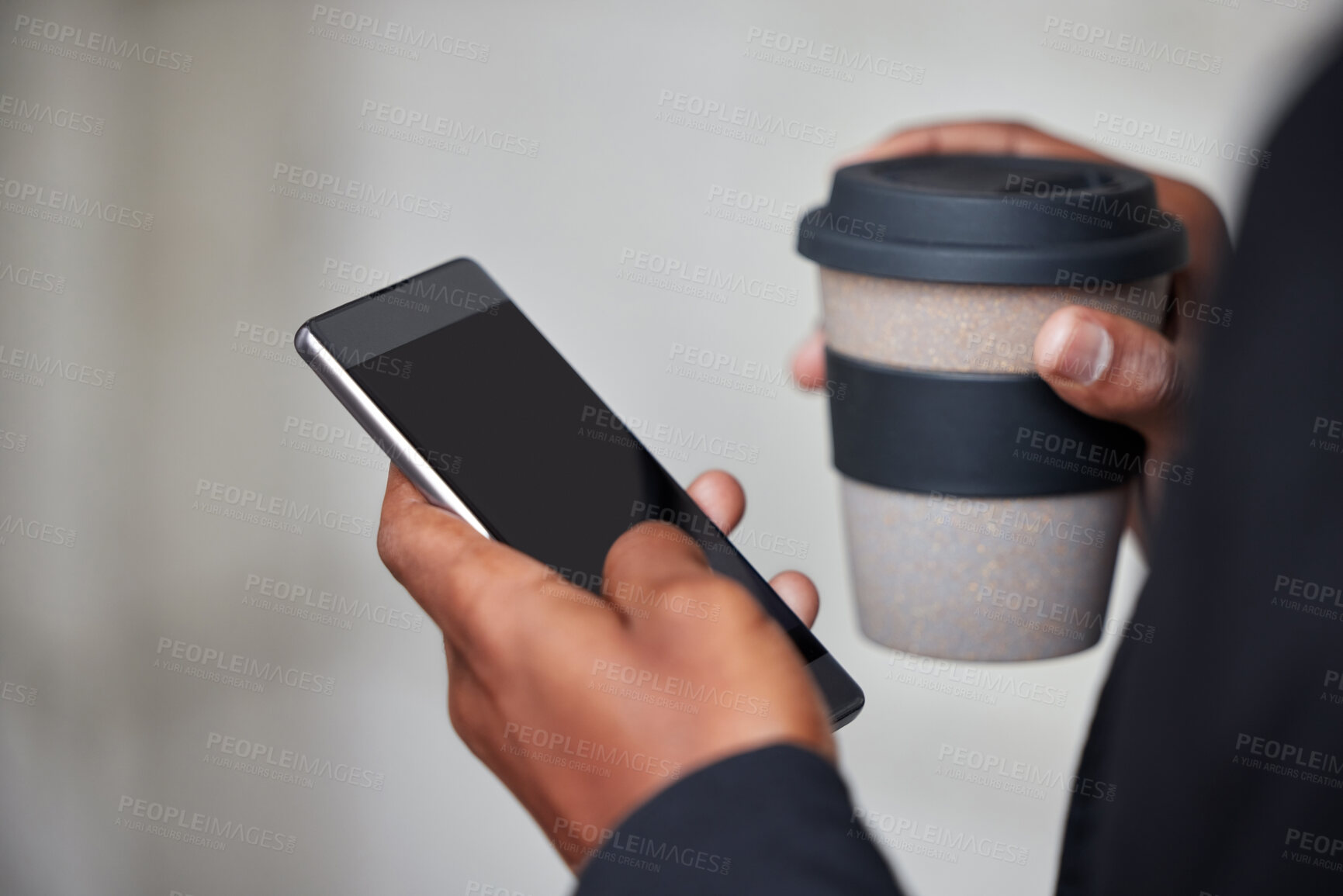 Buy stock photo Shot of an unrecognizable businessman using a phone in the city