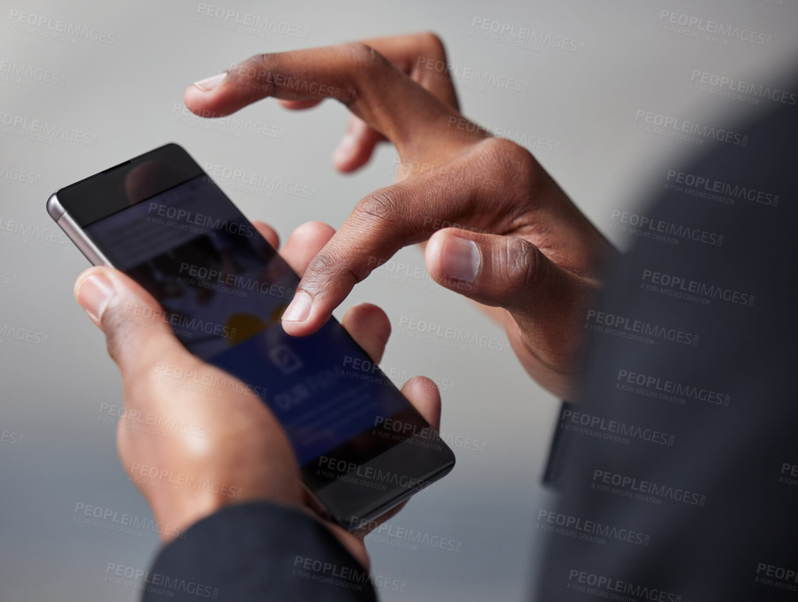 Buy stock photo Shot of an unrecognizable businessman using a phone in the city