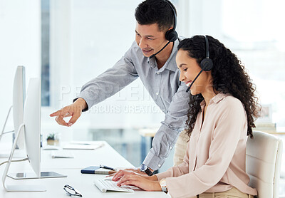 Buy stock photo Call center, man and manager of agency, woman and point of computer, teaching and show of tech support. Office, employees and headset for customer care, service and help with insurance and smile