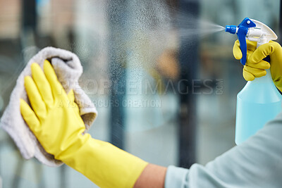 Buy stock photo Closeup, glass and cleaning or gloves with spray bottle in home, soap or chemicals for hygiene. Female cleaner or worker with container or liquid for washing, service at hotel or house with equipment