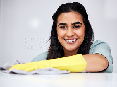 Buy stock photo Indian woman, portrait or cleaner with spray bottle for table, kitchen counter or dirty furniture in home. Smile, maid or janitor washing messy surface with product, liquid soap or cloth with gloves