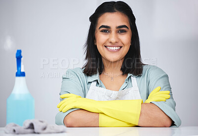 Buy stock photo Portrait, Indian woman and cleaner with smile or spray bottle for table, counter or dirty furniture in home. Arms crossed, maid or proud janitor washing surface with product, liquid soap and cloth