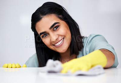 Buy stock photo Indian woman, portrait or cleaner with cloth for table, kitchen counter or dirty furniture in home. Safety, maid or happy janitor washing messy surface with fabric, liquid soap or smile with gloves