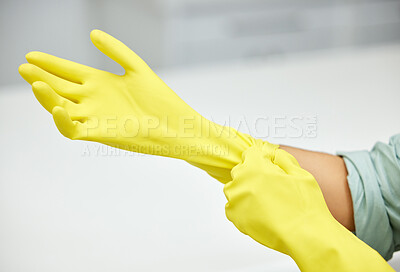 Buy stock photo Hands, cleaning and latex gloves for safety or hygiene while indoor for chores or housework as a maid. Bacteria, service and rubber with a cleaner or janitor getting ready for housekeeping duties