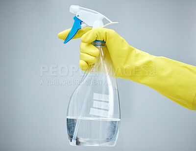 Buy stock photo Person, hands or cleaner in studio with spray bottle for bacteria, wellness or dirty furniture. Grey background, maid or closeup of janitor washing mess with chemical product, liquid soap or gloves