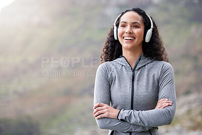 Buy stock photo Mountains, headphones and woman with arms crossed, fitness and exercise with wellness, smile and streaming music. Person, girl or runner with headset, progress and outdoor for workout, audio or sound