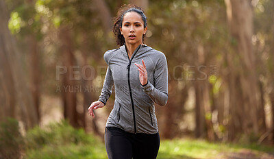 Buy stock photo Shot of a fit young woman out for a run