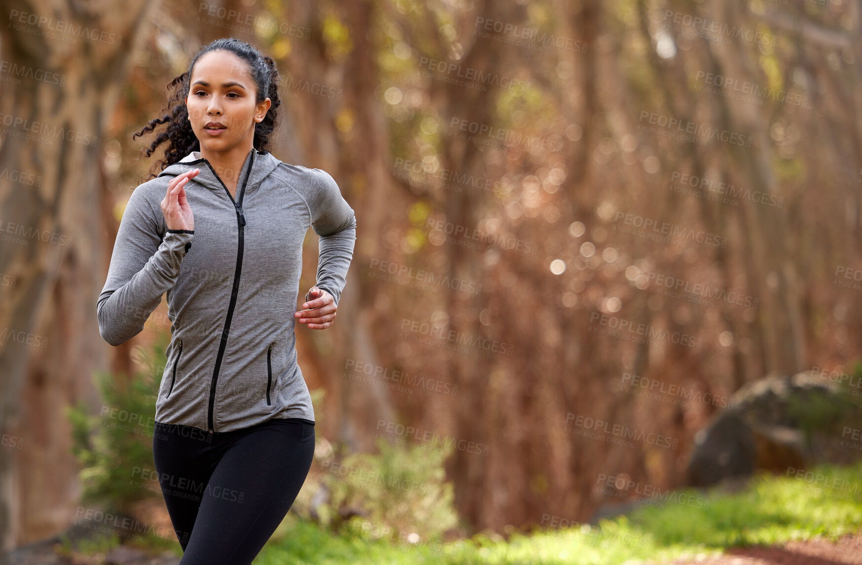 Buy stock photo Woman, running and thinking in nature for exercise, fitness and wellness in forest. Brazilian runner, training and workout by jogging for cardio, commitment and goals or challenge in woods in morning