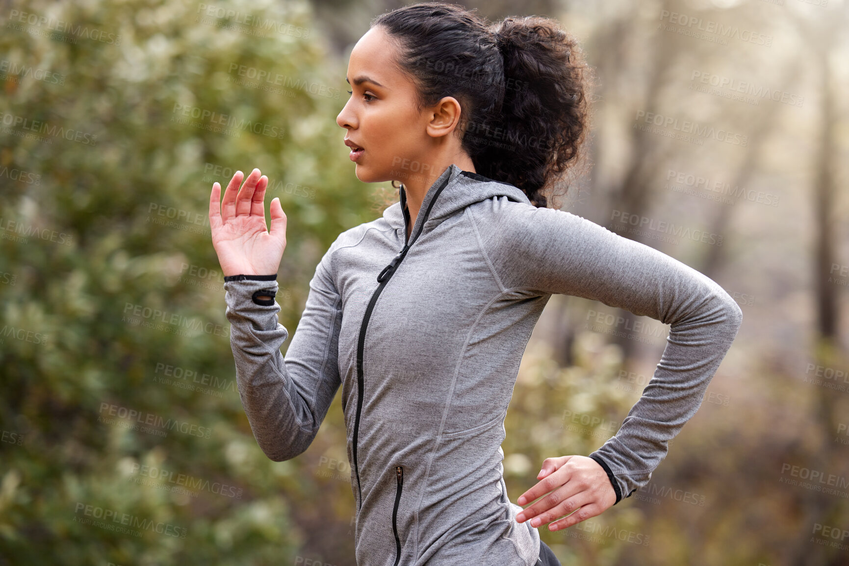 Buy stock photo Shot of a fit young woman out for a run