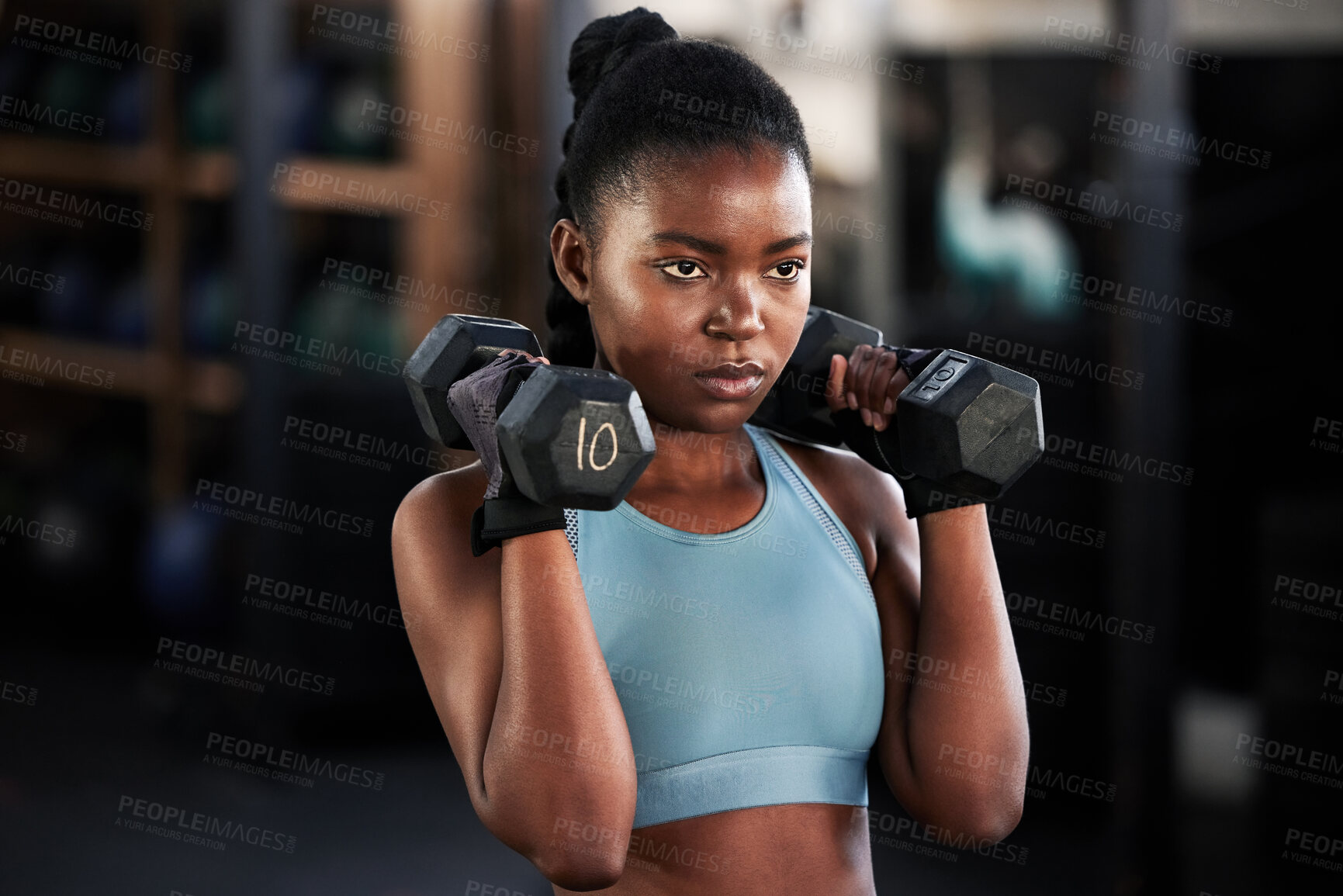 Buy stock photo Fitness, dumbbells or strong black woman training, exercise or workout for powerful arms or muscles. Wellness, health or African girl lifting weights or exercising shoulders with energy in gym studio