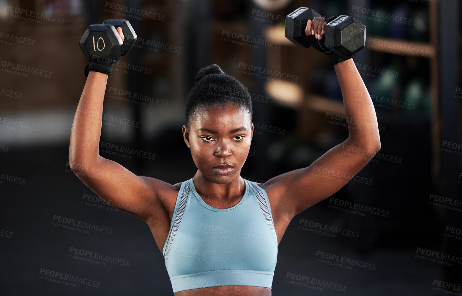 Buy stock photo Gym, dumbbells or strong black woman training, exercise or workout for powerful arms or muscles. Wellness, health or African girl lifting weights or exercising shoulders with energy in fitness studio