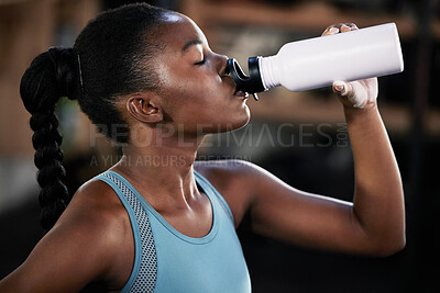 Buy stock photo Tired, fitness or black woman drinking water in gym after training, workout or exercise to relax or hydrate body. Fatigue, fitness or girl with bottle for healthy liquid hydration on resting break