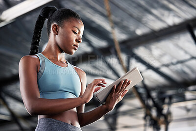 Buy stock photo Black woman, typing or personal trainer with a tablet for fitness training, workout or sports exercise. Progress results, digital technology app or gym instructor planning a online coaching schedule