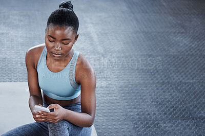Buy stock photo Smartphone, relax or black woman in gym on social media on fitness training, exercise or workout break. Chat, content or African girl athlete texting on mobile app for online digital communication 