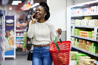 Buy stock photo Happy black woman, supermarket and shopping with phone call, choice or discount in funny chat, customer experience. Plastic basket, grocery store and mall for retail, talking and girl with smartphone