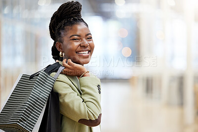 Buy stock photo Shot of a young woman enjoying a day of shopping in the mall