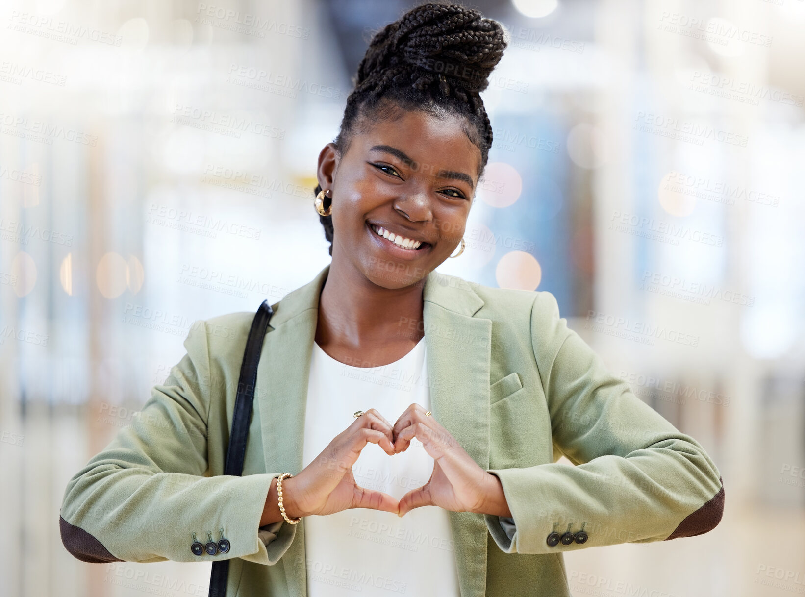 Buy stock photo Shot of a woman forming a heart shape with her fingers