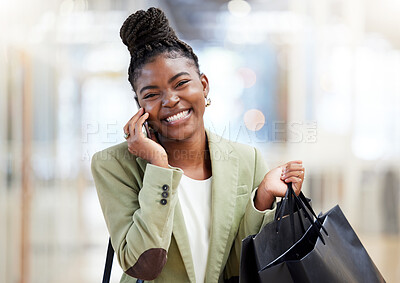 Buy stock photo Shot of a young woman making a phone call while shopping