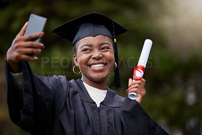 Buy stock photo Shot of a young woman taking selfies on graduation day