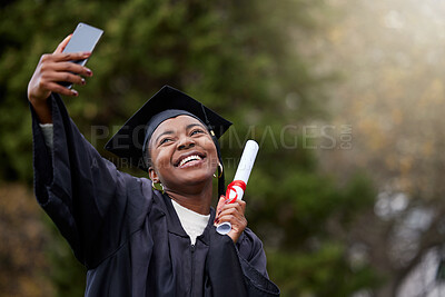 Buy stock photo Shot of a young woman taking selfies on graduation day