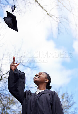 Buy stock photo Success, graduation and a black woman throwing a hat for education achievement at a college. Happy, university and an African student or graduate with a cap in the air on a campus to celebrate