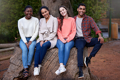Buy stock photo Shot of a group of young friends hanging out on a study break at college