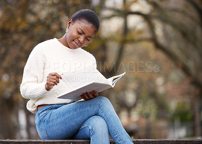 Buy stock photo Woman, reading and notebook in the outdoor at university for knowledge and research at school. Female student, book and learning at the park for an education with a scholarship for motivation. 