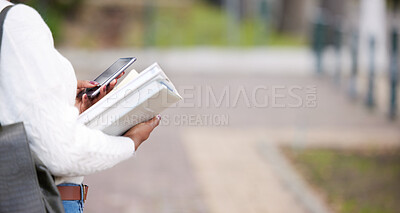 Buy stock photo Shot of a woman using a smartphone outside at college