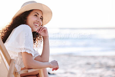 Buy stock photo Shot of an unrecognizable woman enjoying a day at the beach