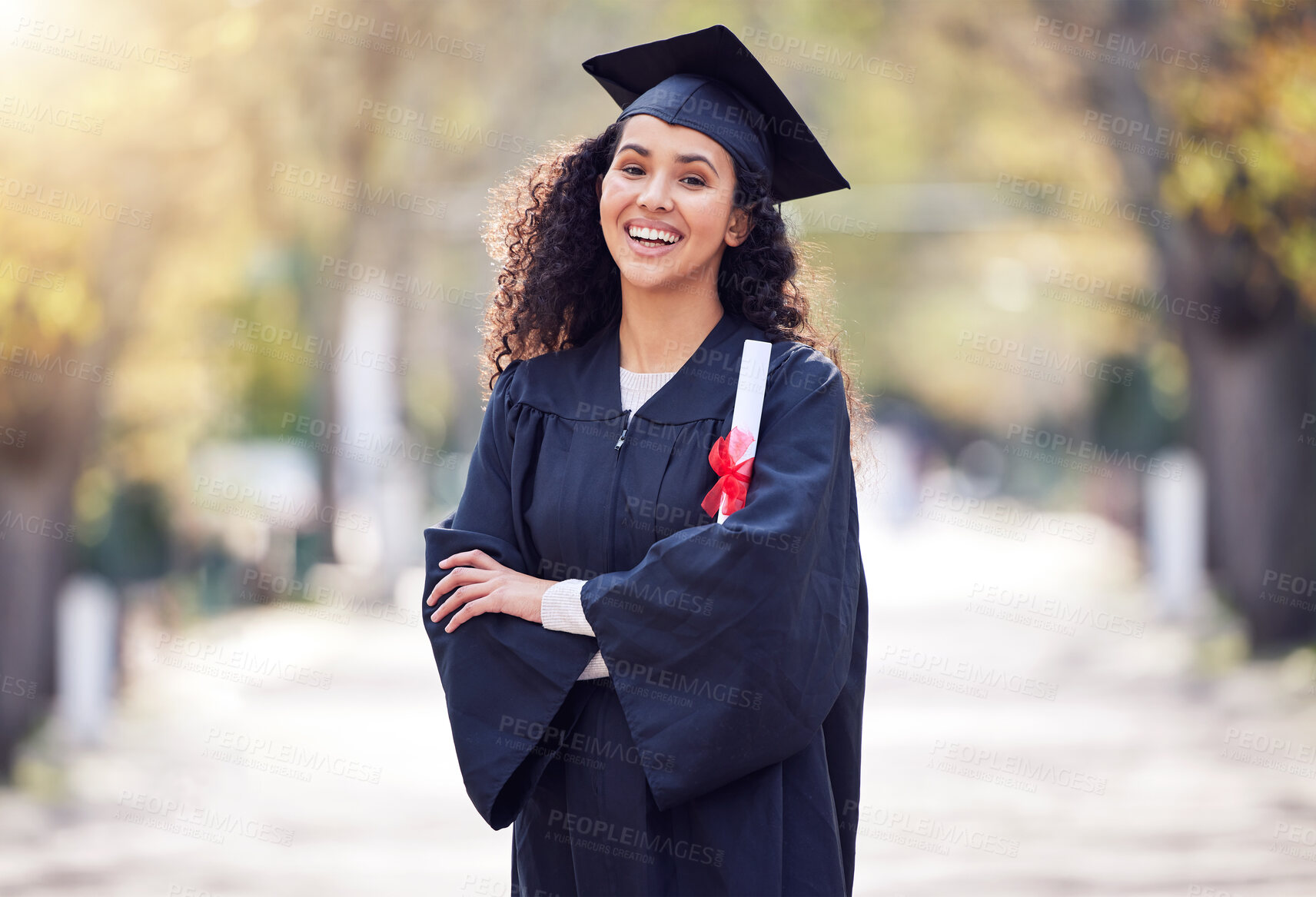 Buy stock photo Shot of a young woman celebrating graduation day