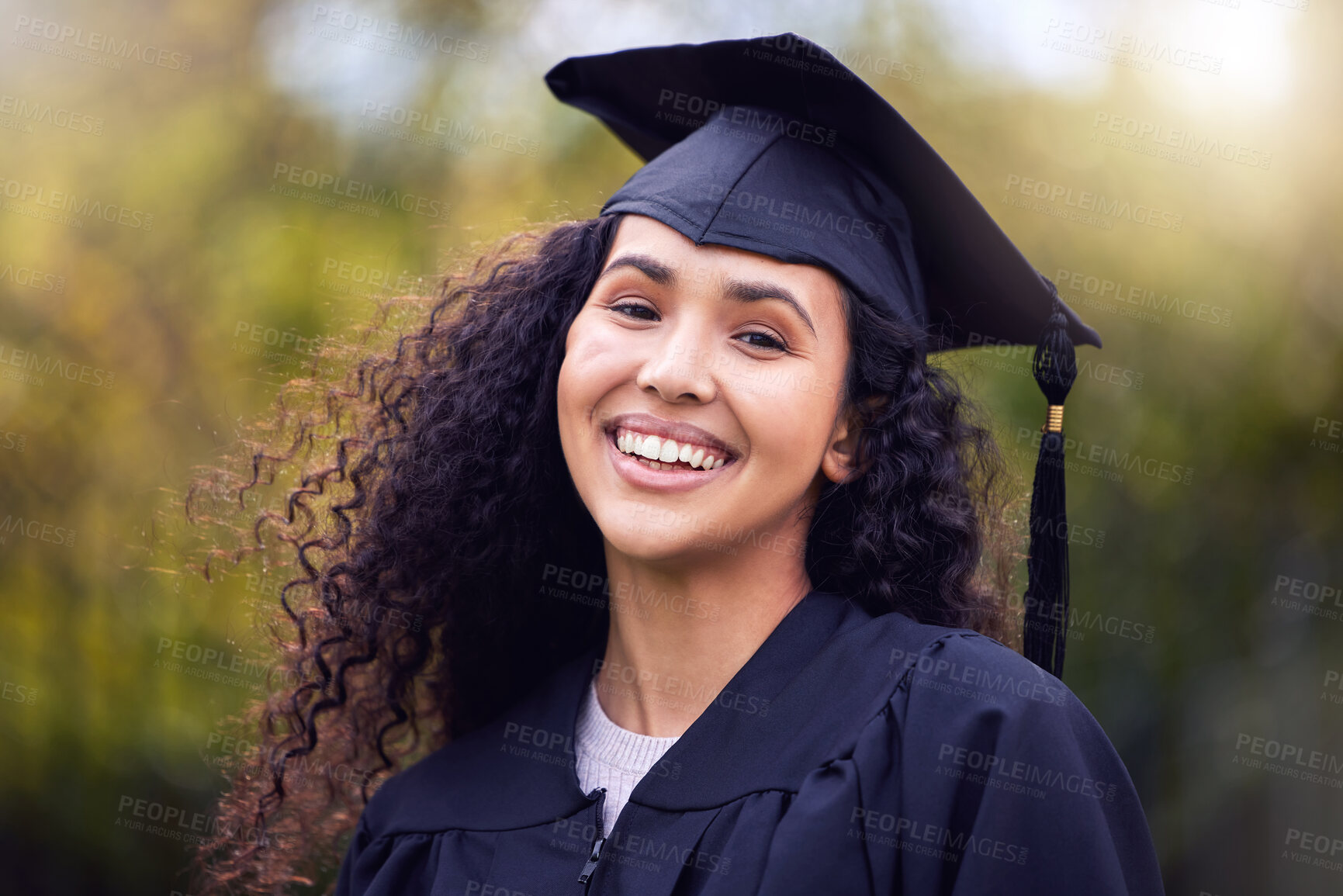 Buy stock photo Shot of a happy young woman celebrating graduation day