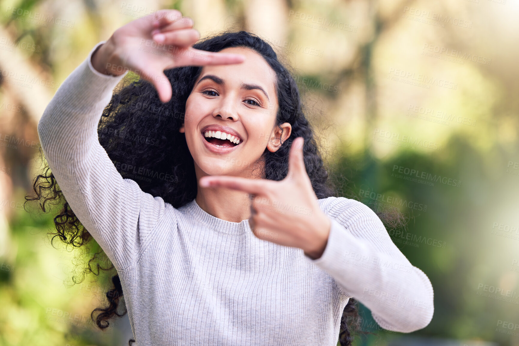 Buy stock photo Nature, portrait and woman with hands in frame for outdoor travel, vacation and weekend trip. Confident, female person and gesture with smile for photography, holiday and happiness in New Zealand