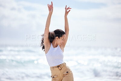 Buy stock photo Shot of a young woman spending a day at the beach