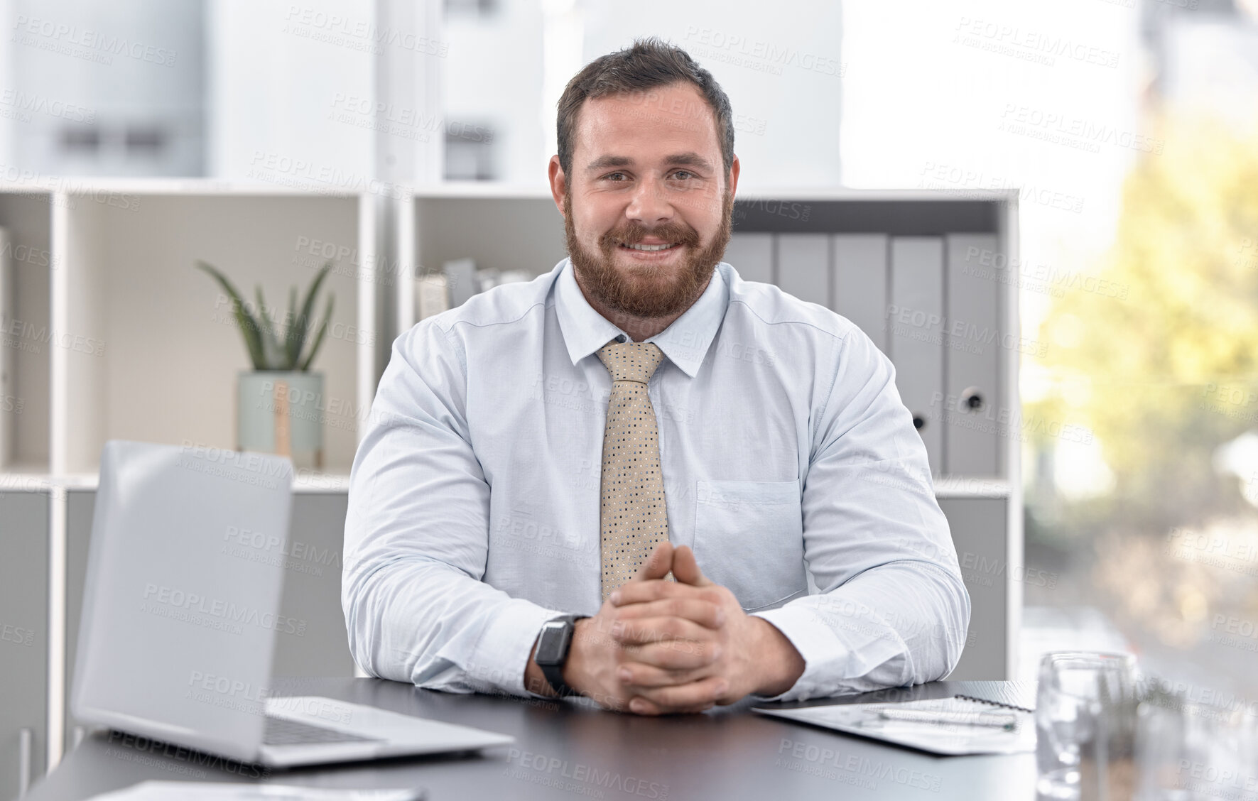Buy stock photo Portrait of a confident young businessman working in an office