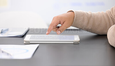 Buy stock photo Closeup shot of an unrecognisable businessman using a digital tablet in an office