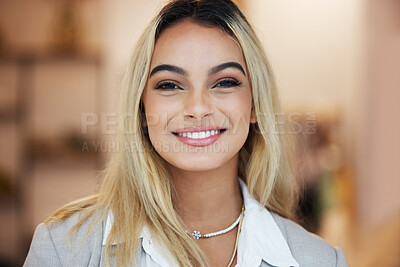 Buy stock photo Shot of a young businesswoman in her clothing store